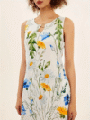 Model wearing the Newness Summer Breeze floral print dress a versatile and comfortable dress with pockets perfect for any season