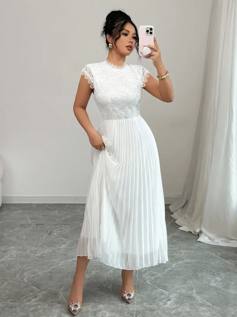 Model wearing a stunning Newness Ethereal Lace Pleated Maxi Dress, perfect for special occasions. The dress features delicate lace detailing and elegant pleats.