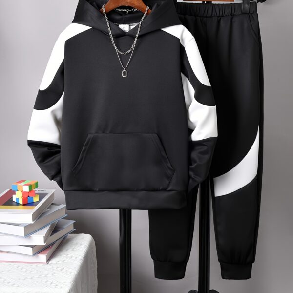 Stylish boys' two-tone striped sweatshirt and jogger set, perfect for casual wear. The comfortable outfit features a trendy design ideal for boys aged 12 and under.