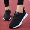 Womens breathable mesh running shoes in pink showing side and front view