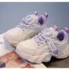 Pastel Petal Girls Sneakers with Rotating Buckle Closure   Trendy pastel pink and white sneakers with a unique rotating buckle perfect for school playdates and sports Breathable comfort and durable rubber sole