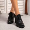 Elegant black lace up high heels with a block heel and ankle strap