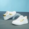 Sparkle Steps Girls EVA Sneakers in white with golden accents showcasing their soft lace up design Perfect for school play or casual wear