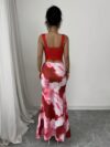 Model wearing the Newness Sunset Hues Ombre Skirt Set a chic two piece outfit featuring a gradient ombre effect in sunset colors The set includes a matching top and skirt showcasing a sophisticated and effortlessly cool summer style