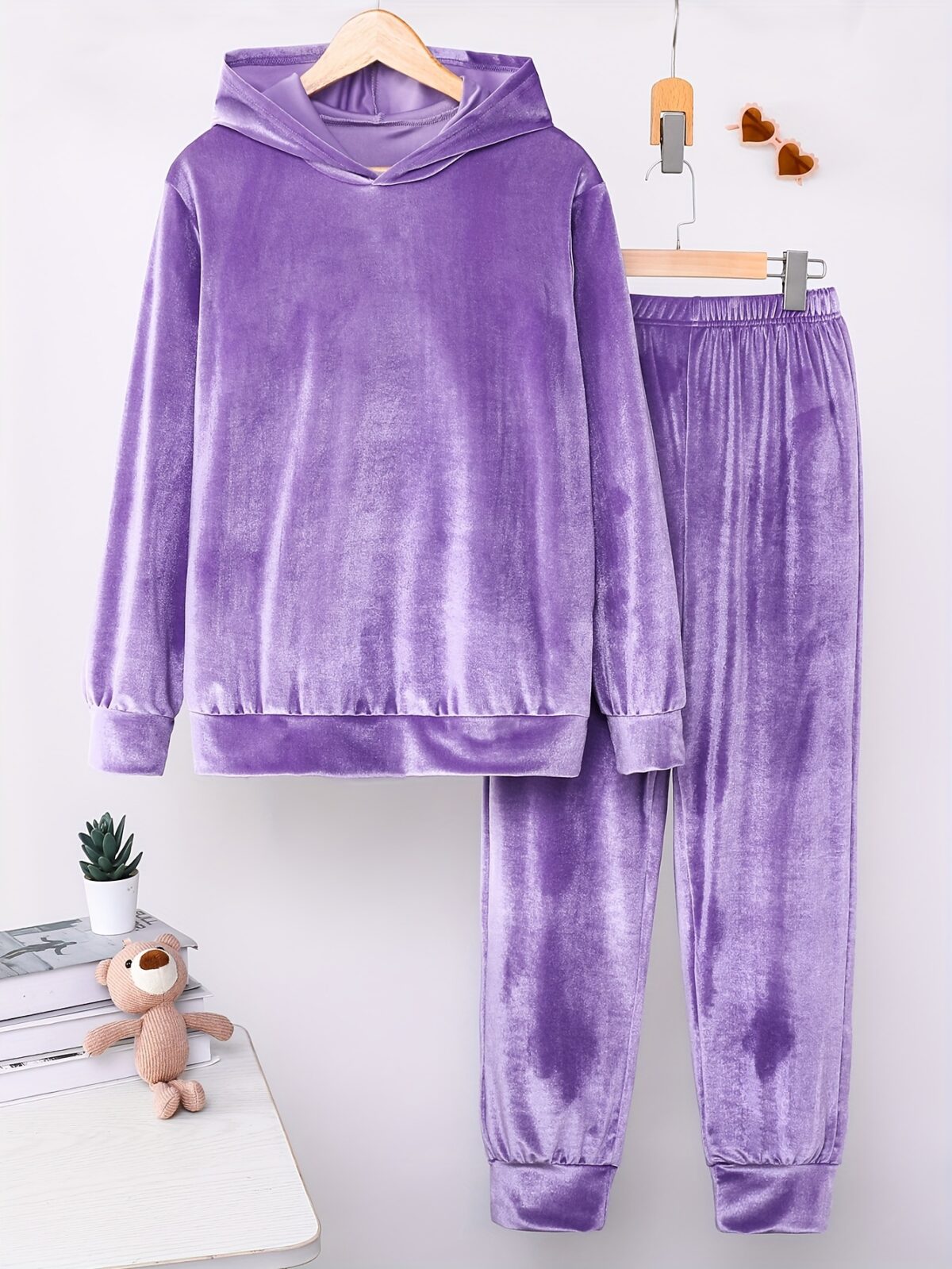 Indulge in ultimate comfort with the Newness Luxe Lounge Velvet Hooded Set This luxurious loungewear set features a plush velvet fabric and a flattering hooded design perfect for relaxing at home or running errands in effortless style
