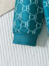 Stylish toddler boy wearing a trendy color block two piece outfit perfect for spring or autumn The outfit features a comfortable soft knit fabric in a vibrant color block design