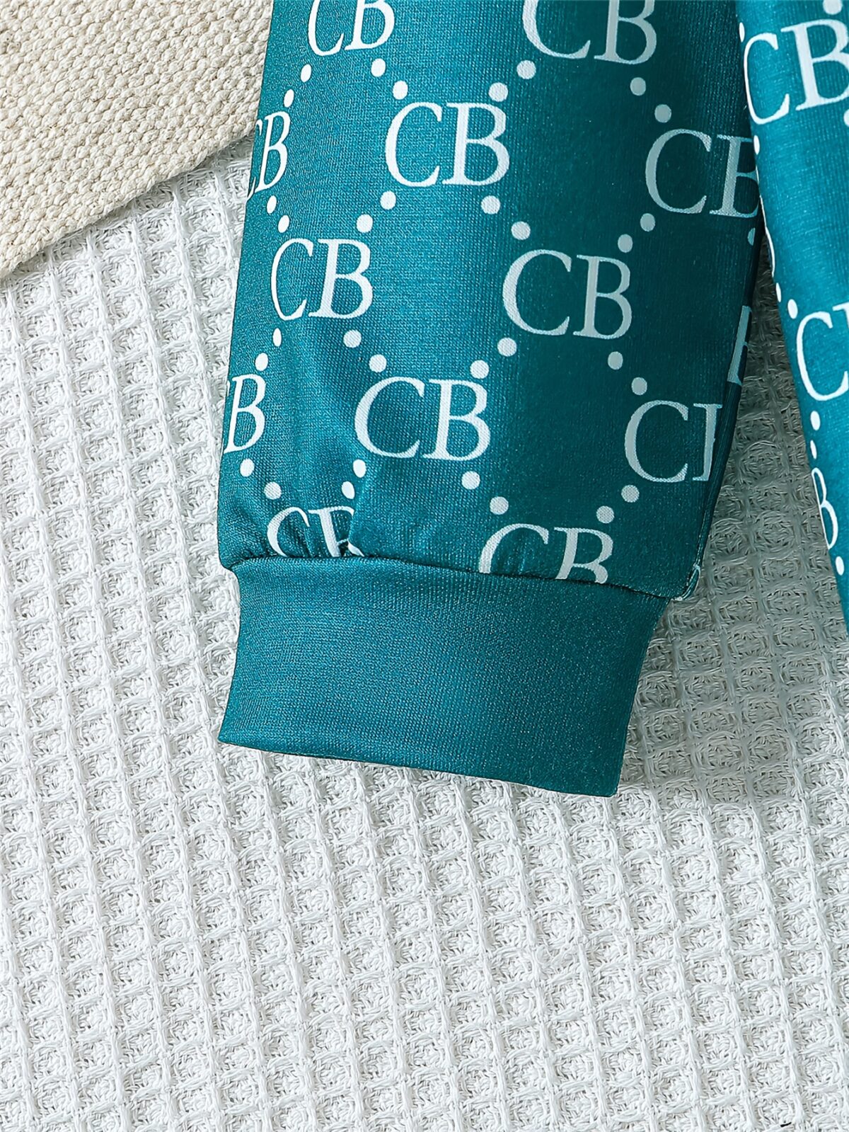 Stylish toddler boy wearing a trendy color block two piece outfit perfect for spring or autumn The outfit features a comfortable soft knit fabric in a vibrant color block design