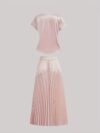 Flatlay of the Newness Bisous Rosé pink pleated midi set showcasing the skirt and top separately and together The set is a beautiful shade of pink and features delicate pleats