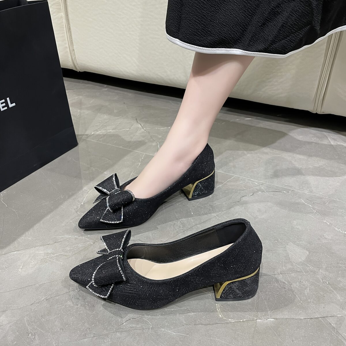 Newness Evening Star Glittery Black Pumps Elevate your style with these versatile and chic black pumps featuring dazzling glitter