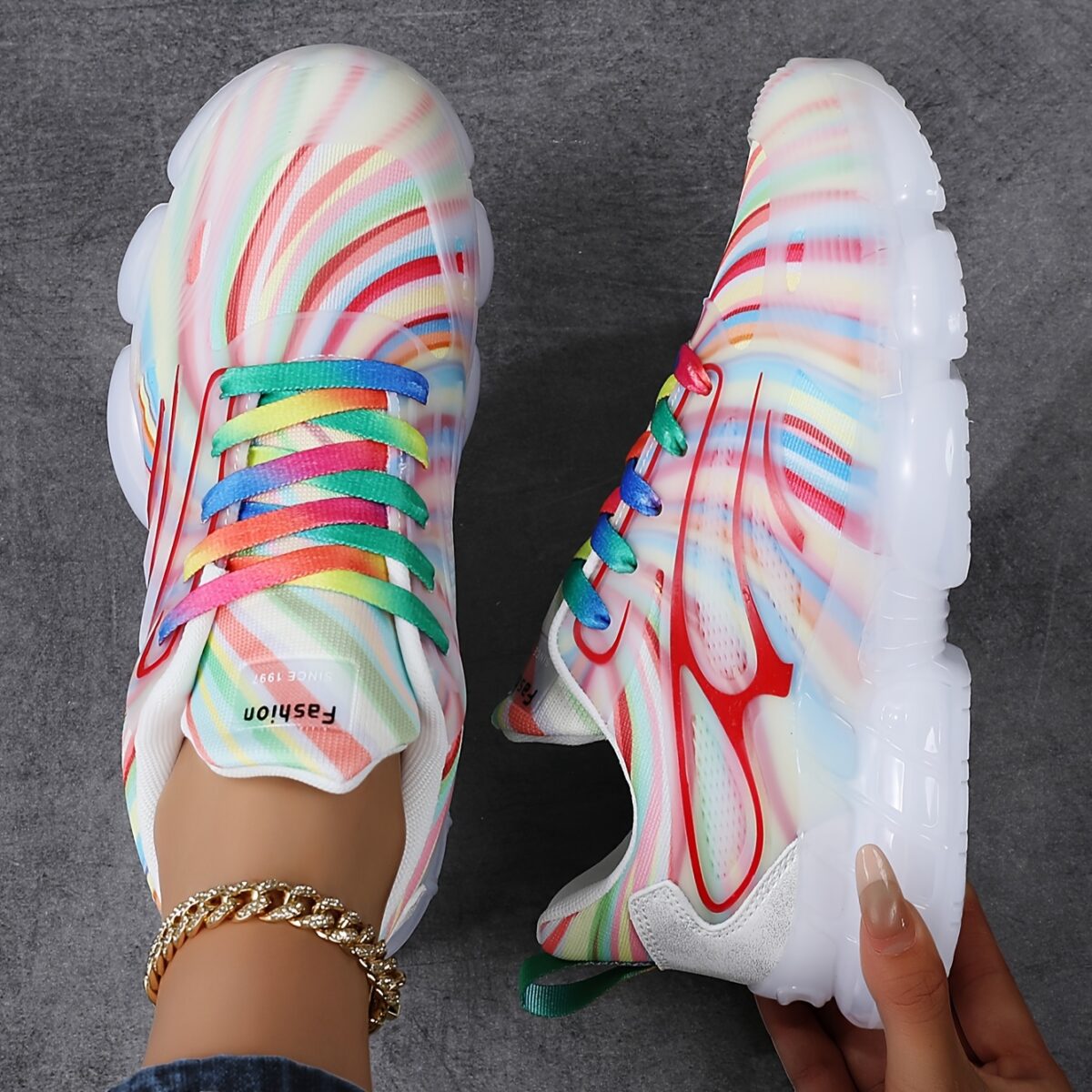 Newness Prism Rainbow Stripe Sneakers A vibrant pair of rainbow striped sneakers showcasing breathable comfort and stylish design perfect for all day wear