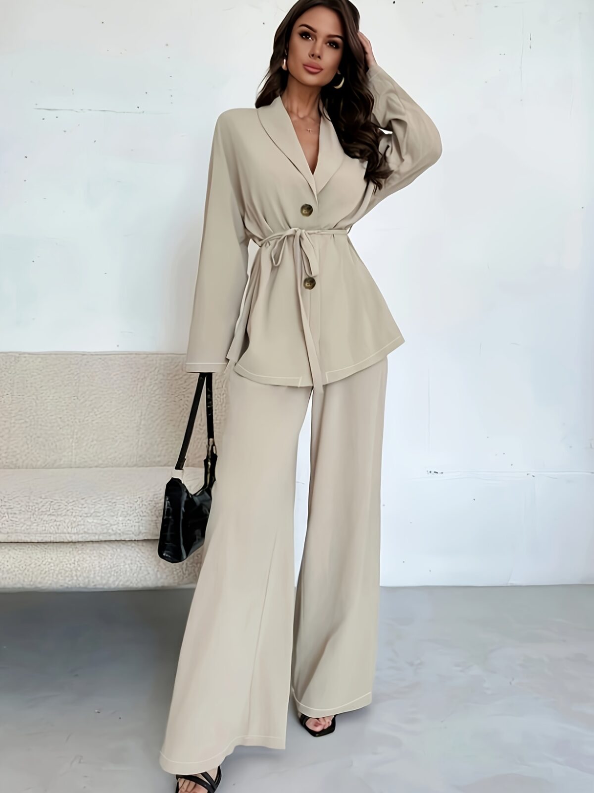 The Newness Milan Tie Waist Blazer Set a chic two piece outfit featuring a tailored blazer and matching pants cinched at the waist for a flattering silhouette Perfect for work or weekend