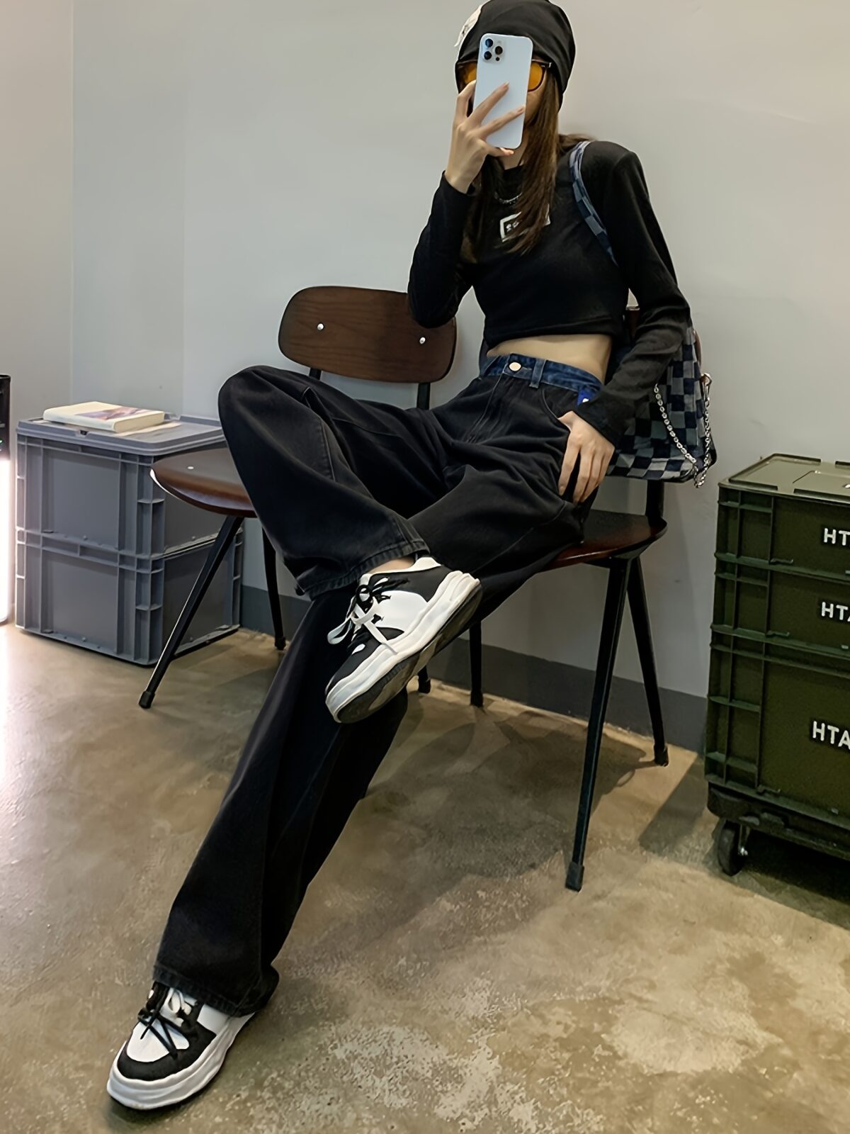 Model wearing Newness Seoul Street Style High Waisted Wide Leg Jeans showcasing the comfortable fit and chic style The jeans are a wide leg style with a high waist