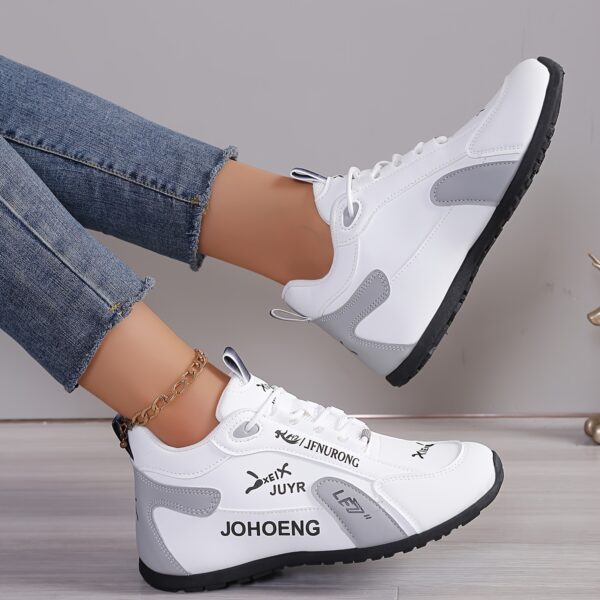 Newness City Chic Women's White Sneakers: Chic, sporty white sneakers perfect for everyday wear. Close-up view showcasing the stylish design and comfortable features.