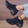Womens black slip on sneakers with breathable knit upper comfortable wedge heel and cushioned sole