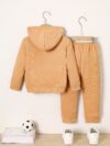 Newness Cozy Champ Boys Waffle Knit Set in soft waffle knit fabric featuring a hooded top and pants perfect for winter adventures