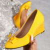 Newness Sunshine Stroll Glossy Yellow Wedge Bow Heels Step into sunshine with these elegant yellow wedge heels featuring a glossy finish and charming bow detail Perfect for adding a touch of summery sophistication to any outfit