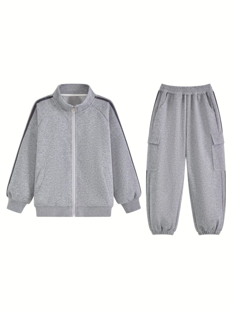Stylish boys' tracksuit in trendy design. Raglan sleeve zip hoodie and matching sweatpants, perfect for play or sports. Available in sizes 4-12.