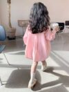 Adorable girl wearing Newness Riviera Chic summer outfit a stylish and breathable dress perfect for sunny days