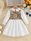 Newness Kensington Jacquard Floral Dress A chic and elegant floral dress perfect for spring Close up view showing the intricate jacquard fabric and flattering silhouette