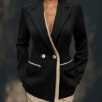 Sophisticated white double breasted womens blazer with asymmetrical hem long sleeves and high quality polyester fabric perfect for professional settings