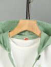 Stylish boys color block jacket and pants set featuring embroidered dinosaur details Perfect for spring or fall
