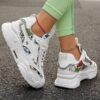Newness Bloomsbury Floral Print Sneakers Comfortable and breathable floral print sneakers perfect for any occasion