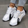 Newness City Chic Striped Athletic Sneakers Stylish striped sneakers perfect for everyday wear Close up view showcasing the chic design and comfortable athletic build
