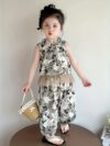 Whimsical Wanderlust Animal Print Set by Newness A stylish two piece outfit featuring an animal print ideal for summer adventures