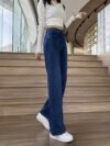 Flatlay of Newness Parisian High Waisted Wide Leg Jeans in a stylish setting The durable denim and flattering wide leg silhouette are highlighted