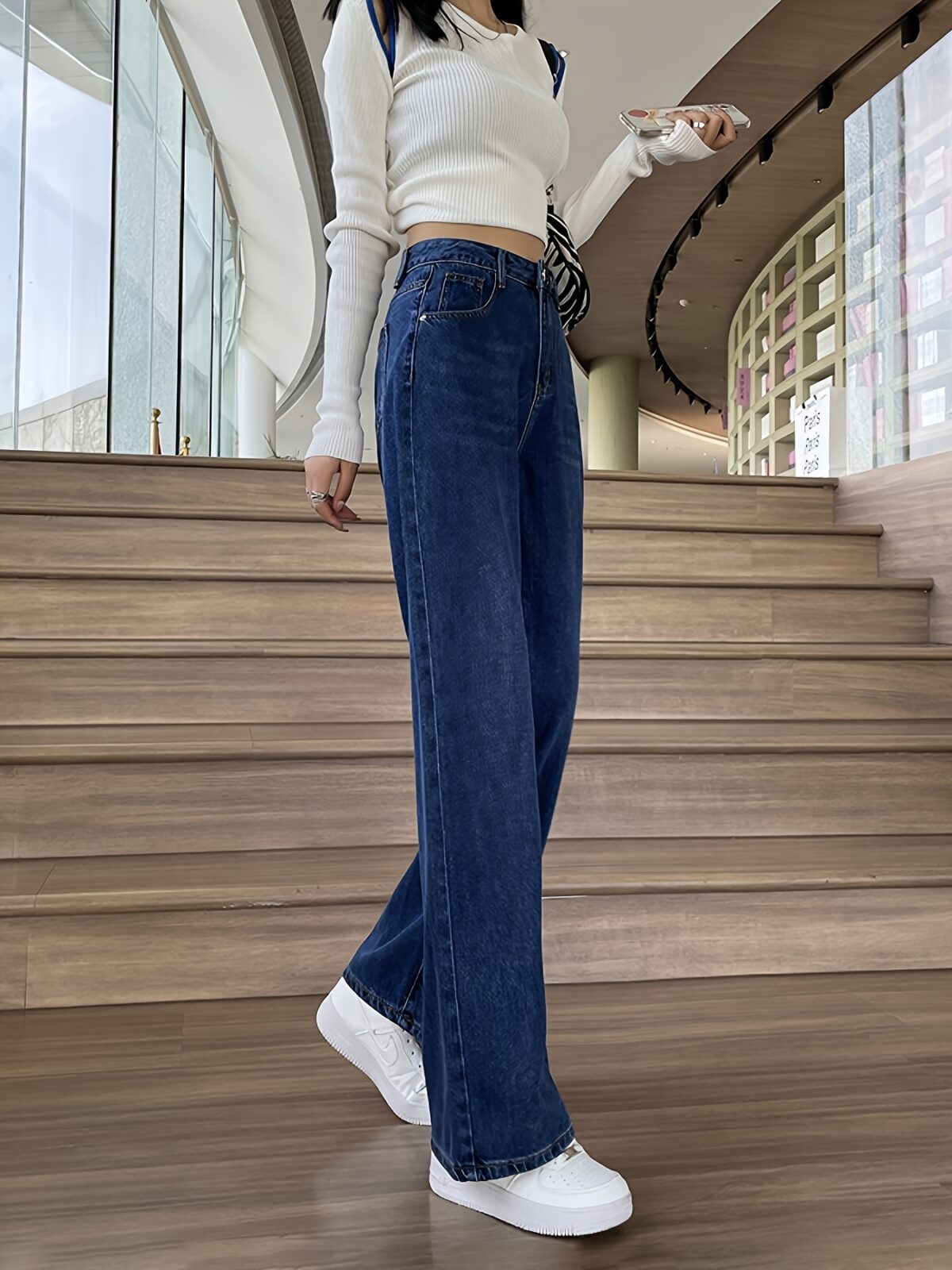 Flatlay of Newness Parisian High Waisted Wide Leg Jeans in a stylish setting The durable denim and flattering wide leg silhouette are highlighted