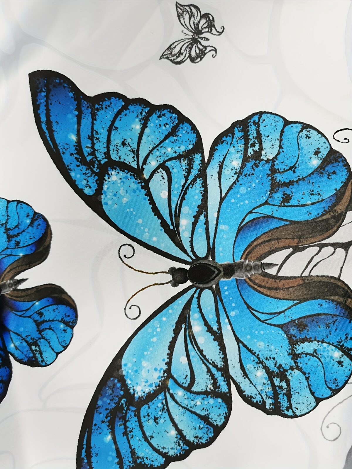Newness Azure Dreams Butterfly Print Dress Set A chic and elegant butterfly print dress and matching set perfect for spring occasions