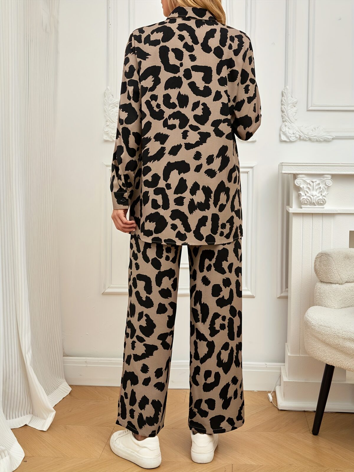 Stylish and sophisticated womens Safari Chic Leopard Print Pants Set from Newness The two piece set includes a matching top and pants both featuring a chic leopard print