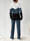 The Newness Riviera Color Block Hoodie Set in a flattering pose showcasing its vibrant color blocking and comfortable fit Perfect for spring or fall