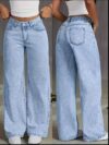 Model wearing Newness Dubai Breeze Wide Leg Jeans a light wash high waisted pair of wide leg jeans
