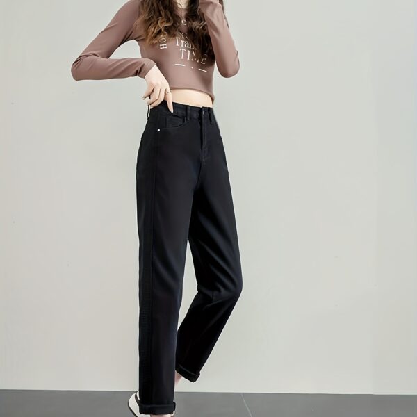 Model wearing Newness Cairo Nights High Waisted Harem Pants showcasing the comfortable flowing fabric and chic effortless style