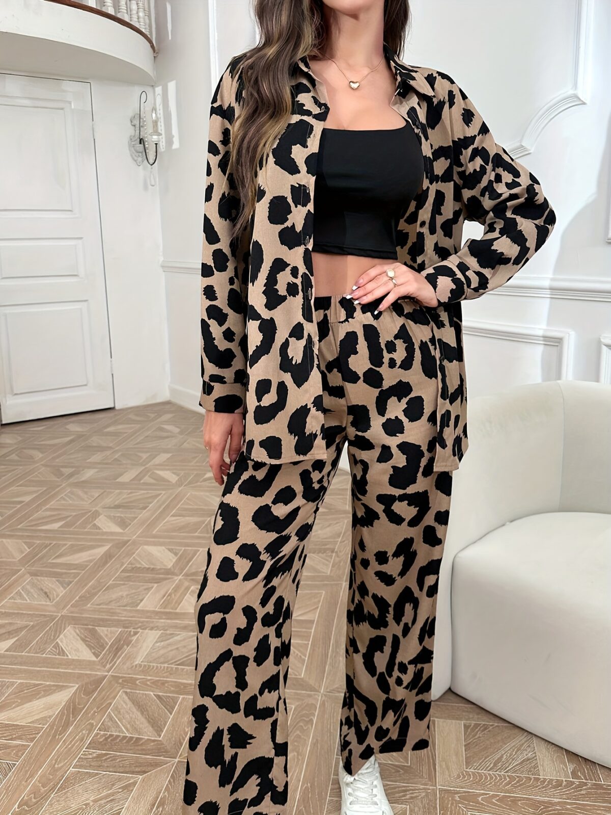 Stylish and sophisticated womens Safari Chic Leopard Print Pants Set from Newness The two piece set includes a matching top and pants both featuring a chic leopard print