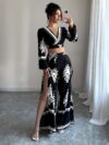 Effortlessly chic Casablanca Ethnic Print Set from Newness featuring a backless top and wide leg pants Model showcases the two piece outfit