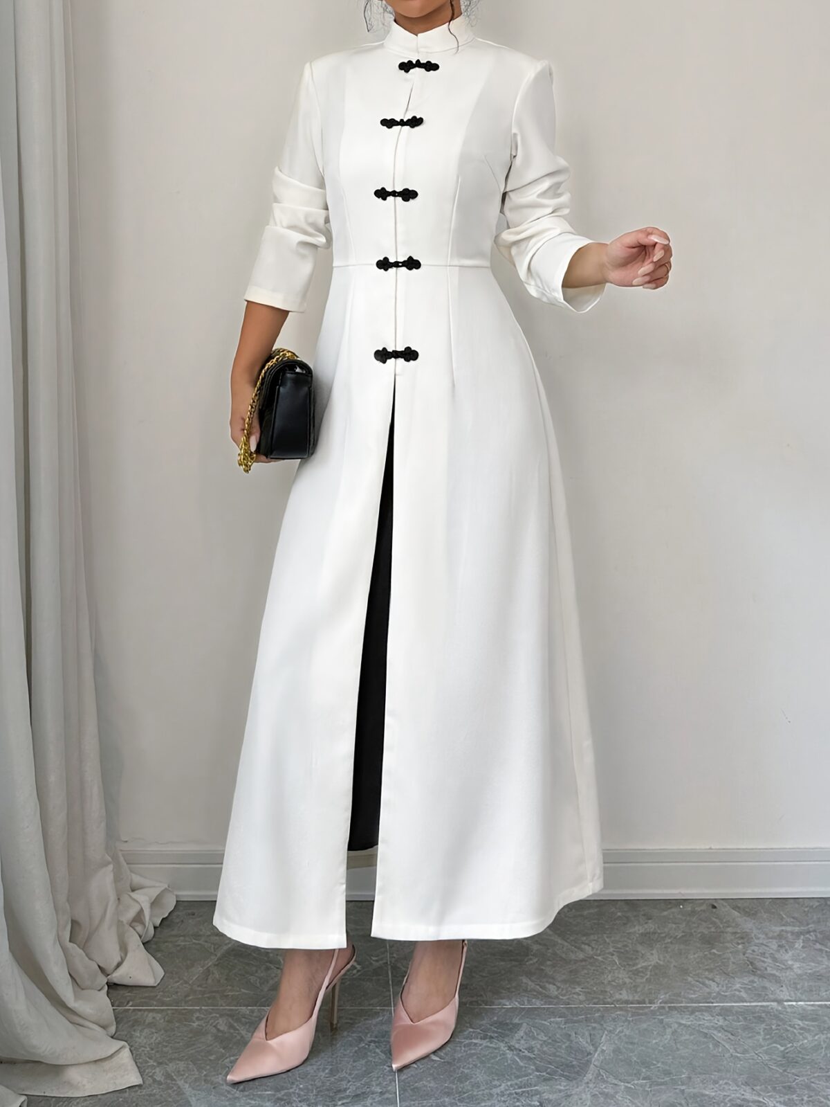 Flattering Timeless Chic Womens Stand Collar Tunic in versatile 100 polyester Featuring a chic stand collar and contrast button details this tunic offers elegance and comfort for all seasons
