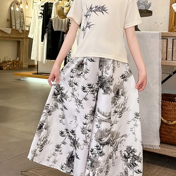 Newness Botanical Bliss Girls Summer Outfit A charming two piece set ideal for summer Features a stylish top and comfortable bottoms in a botanical print