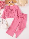 Adorable girls two piece outfit in breathable fabric featuring a charming bow detail and stylish wide leg pants perfect for autumn outings