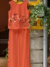 Embrace effortless chic in the Marrakech Sunset Embroidered Summer Jumpsuit This vibrant orange jumpsuit features intricate butterfly embroidery and a flattering wide leg silhouette