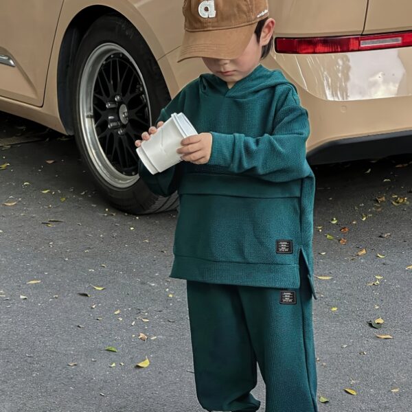 Newness Cozy Champ Boys Waffle Knit Set in soft waffle knit fabric, featuring a hooded top and pants, perfect for winter adventures.