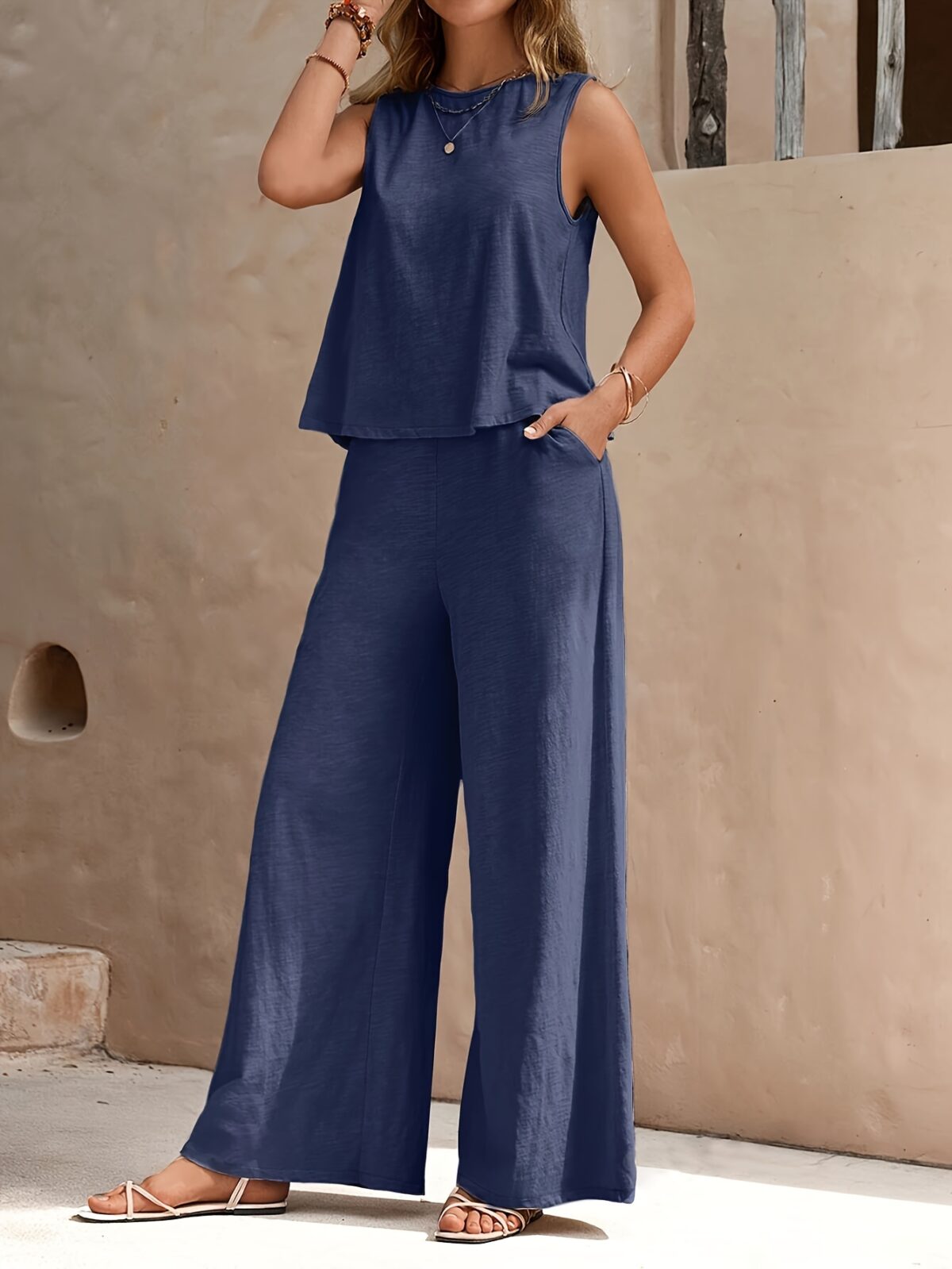 The Newness Cairo Sleeveless Wide Leg Set in white featuring a relaxed sleeveless top and wide leg pants perfect for a spring or summer day