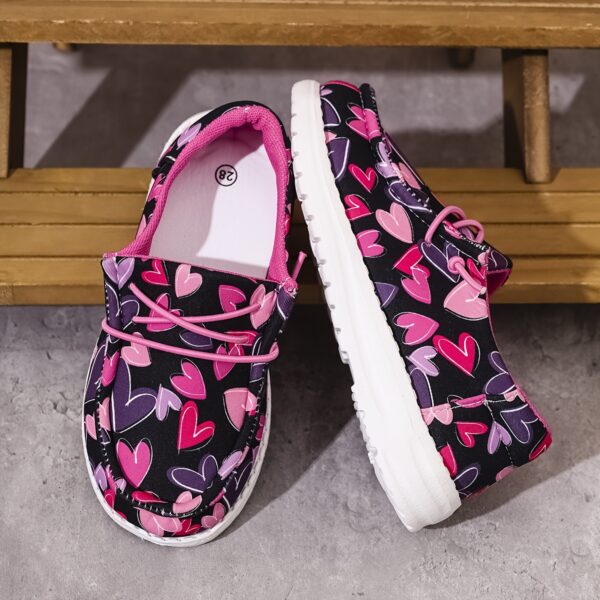Adorable girls heart canvas loafers in a trendy slip on style perfect for casual wear and outdoor fun Comfortable and stylish these heart patterned shoes are ideal for all seasons