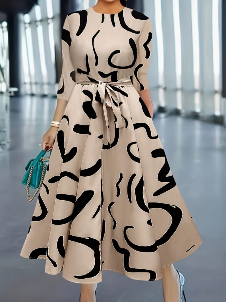 Geometric print dress, flattering silhouette, modern and chic style.