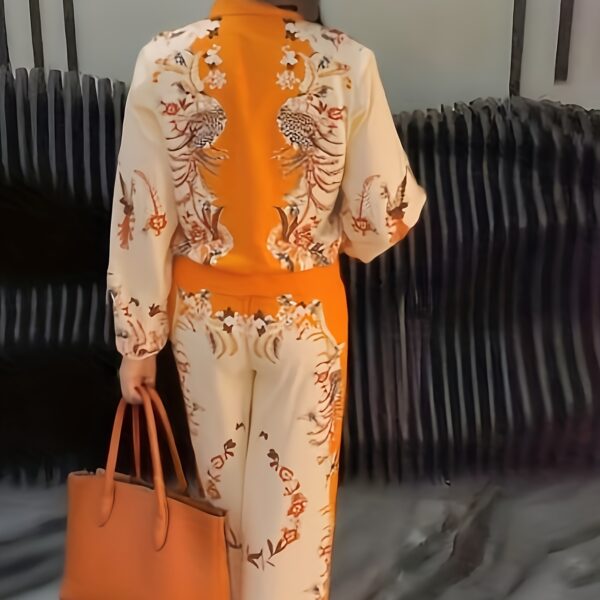 Model wearing the Newness Sunset Hues Ombre Print Two Piece Set showcasing the gradient colors and comfortable fit