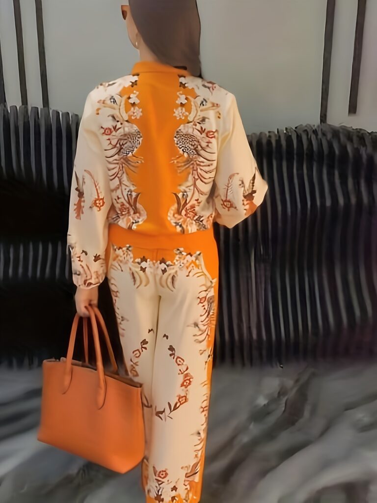 Model wearing the Newness Sunset Hues Ombre Print Two-Piece Set, showcasing the gradient colors and comfortable fit.