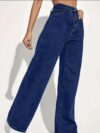 Model wearing Newness Dubai High Waisted Wide Leg Jeans a versatile pair of premium denim jeans in a flattering wide leg silhouette and high waisted fit perfect for any season
