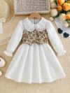 Newness Kensington Jacquard Floral Dress A chic and elegant floral dress perfect for spring Close up view showing the intricate jacquard fabric and flattering silhouette