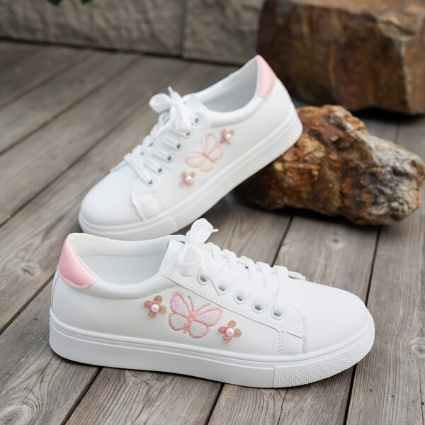 Newness Blush Butterfly Lace Up Sneakers Chic blush colored sneakers with butterfly accents and lace up closure perfect for spring